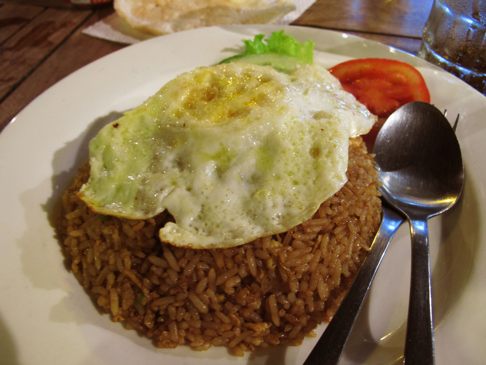 indonesian nasi goreng with a fried egg on top