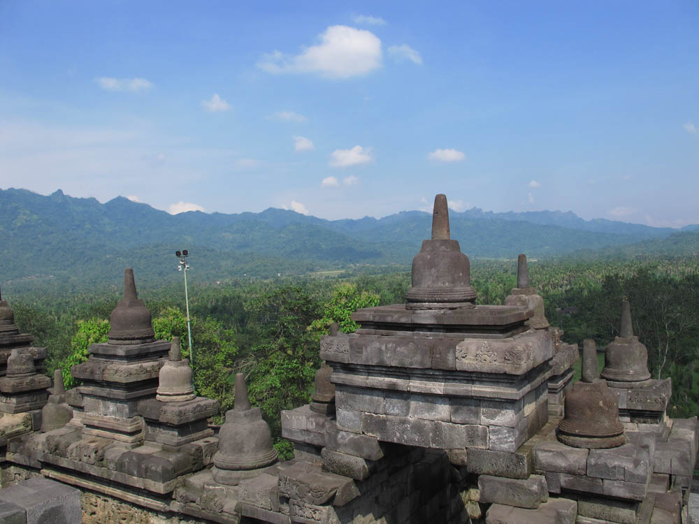 mountains surround Borobudur Temple on Java