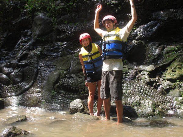 stone carvings along the river during rafting trip in Ubud Bali