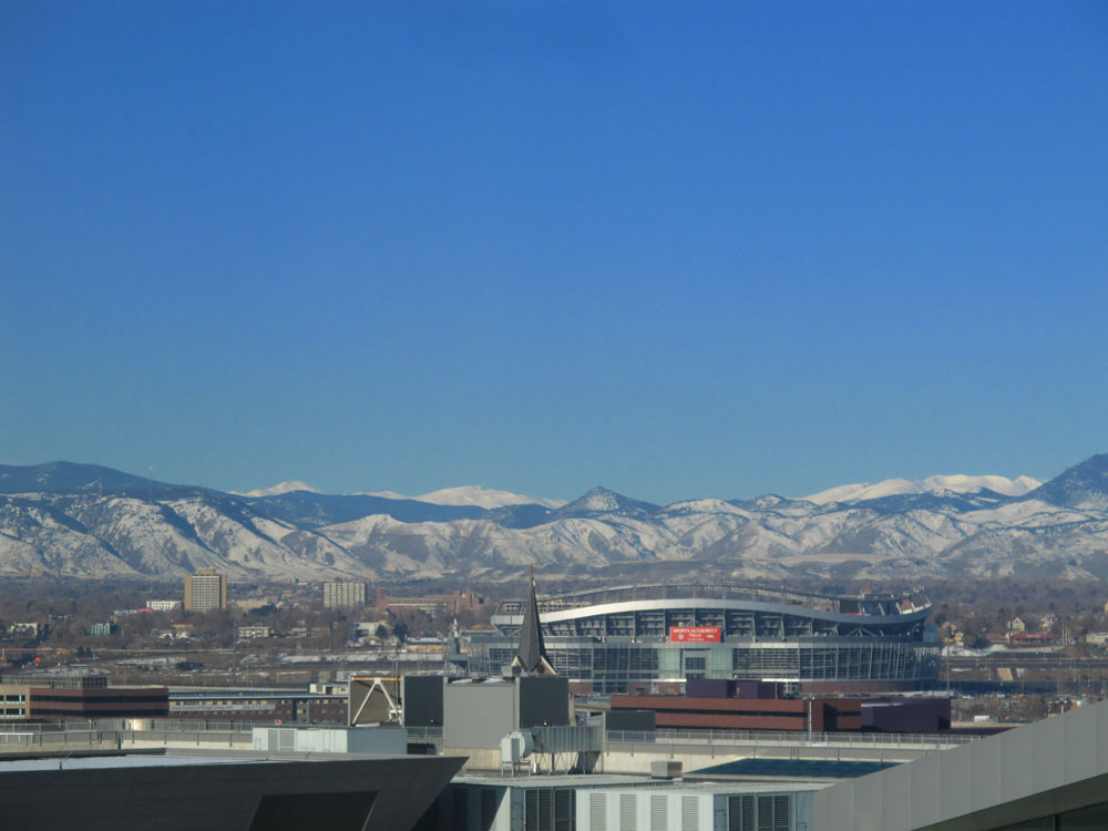 view of the rockies from downtown denver colorado