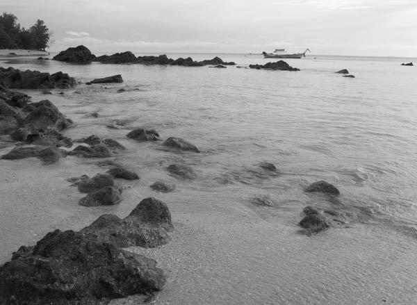 rocky end of beach on Koh Jam Thailand
