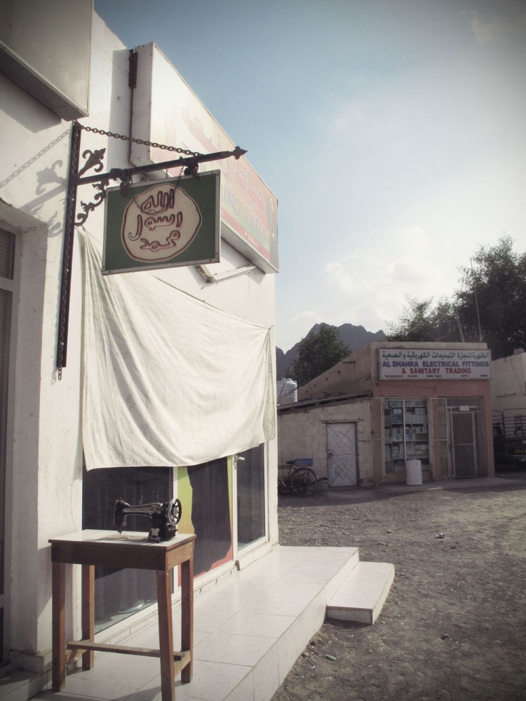 A shop in a village near Hatta A shop in a village near Hatta covers their window with a sheet to block the intense afternoon desert sun