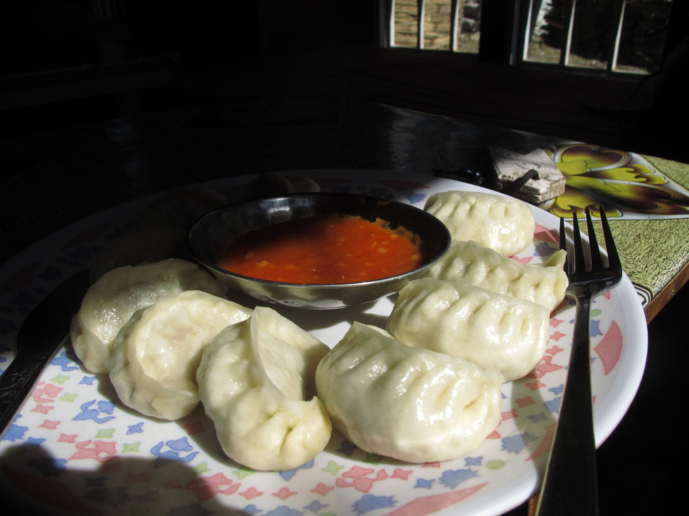 nepal vegetarian momos served with tomato sauce