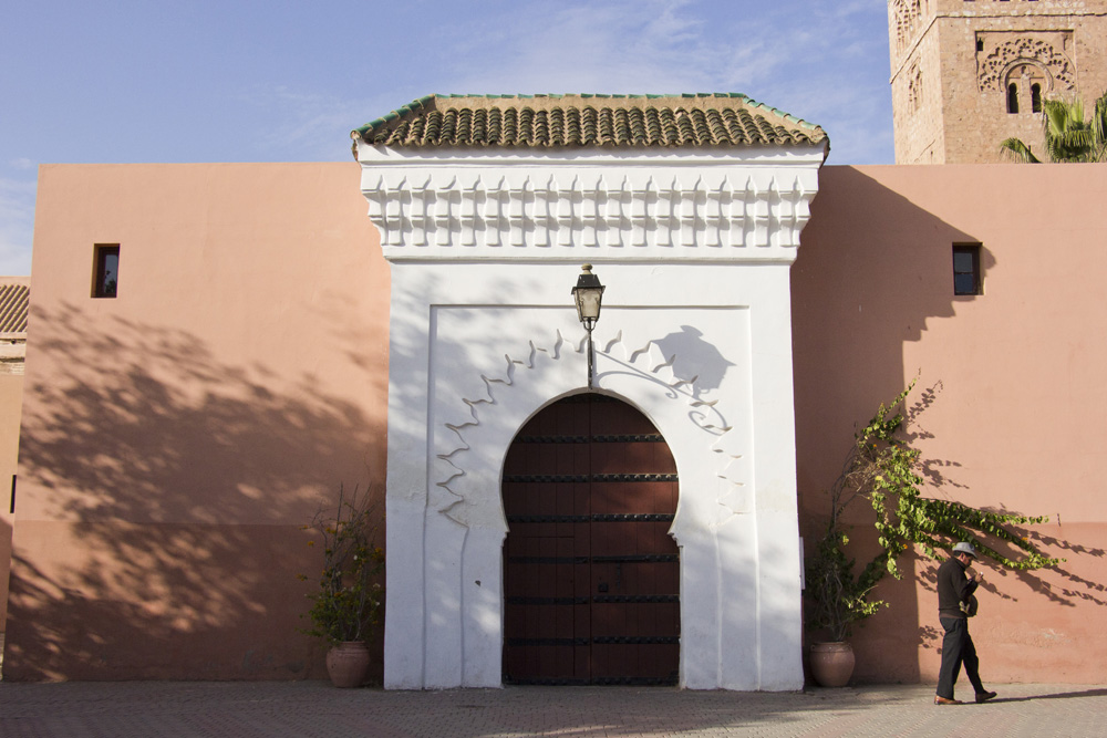 Glued to phone at the Koutoubia Mosque | Marrakech, Morocco