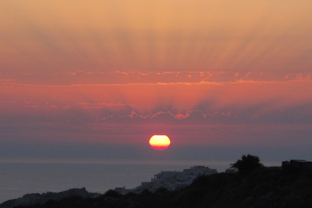 Flared sunset from Oia | Santorini, Greece