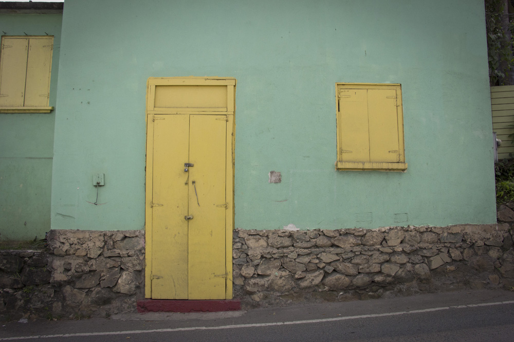 Aqua house with a yellow door | St John, USVI