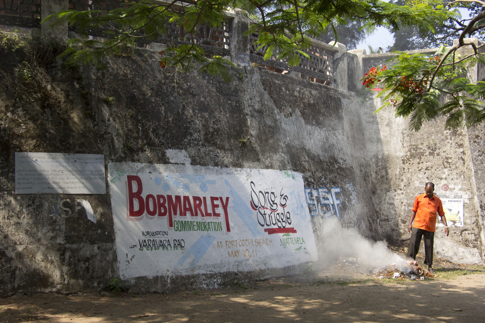 Bob Marley watches over a trash burn | Fort Cochin, India