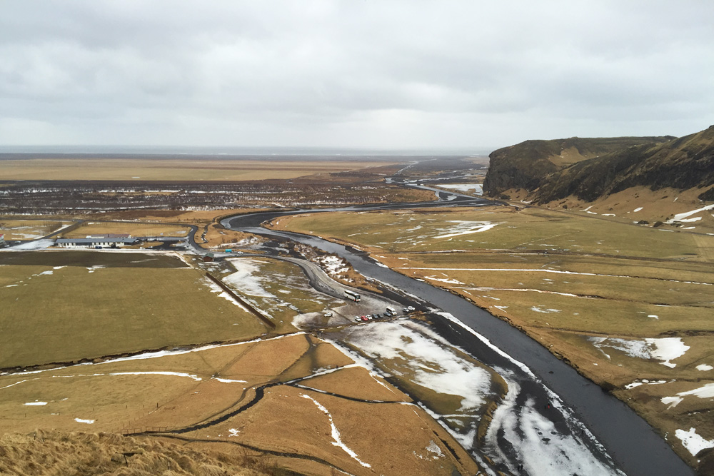 View to the coast from the top of Skogafoss | Iceland