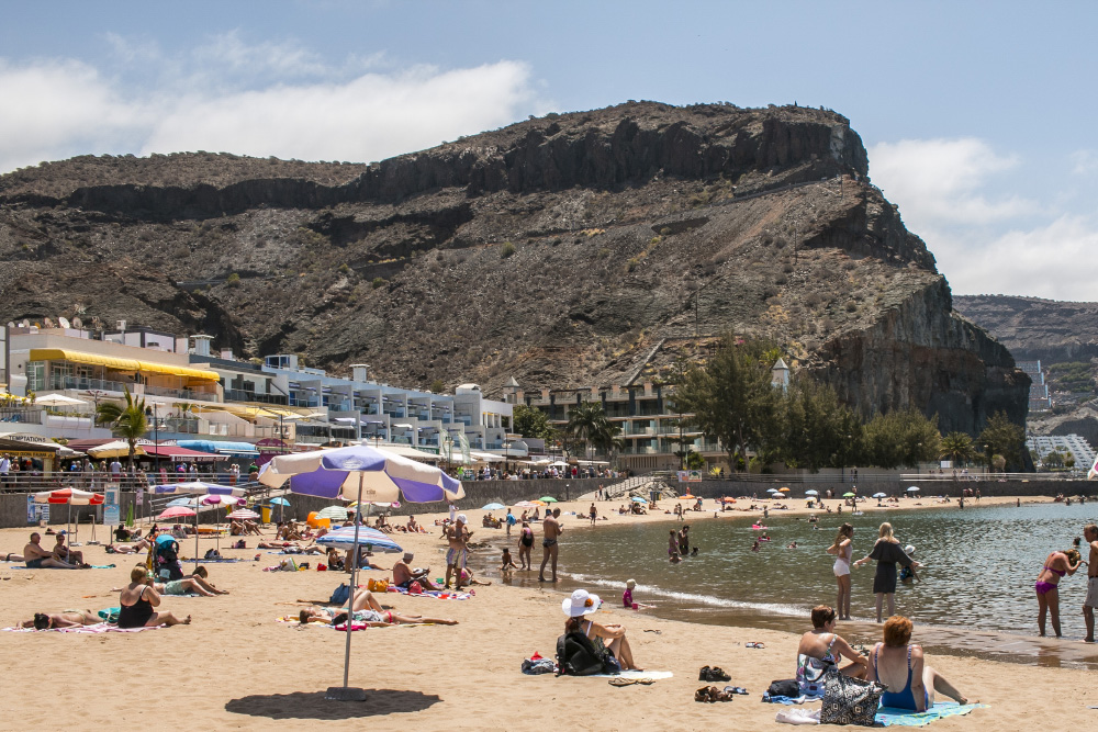 Laying on the sandy beach | Puerto Mogan, Gran Canaria, Spain