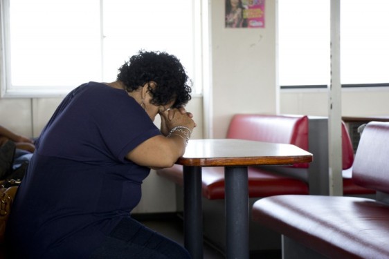 woman-praying-ferry-ometepe-nicaragua