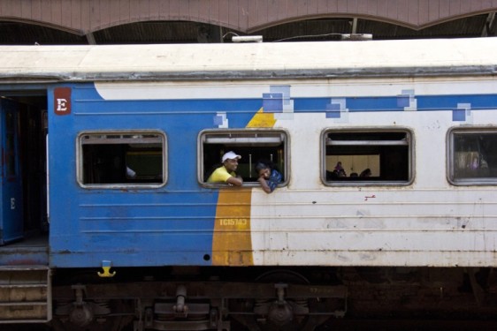 Hanging out the window | Colombo train station, Sri Lanka