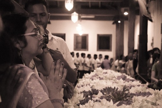 Prayers over flowers at the Temple of the Tooth| Kandy, Sri Lanka