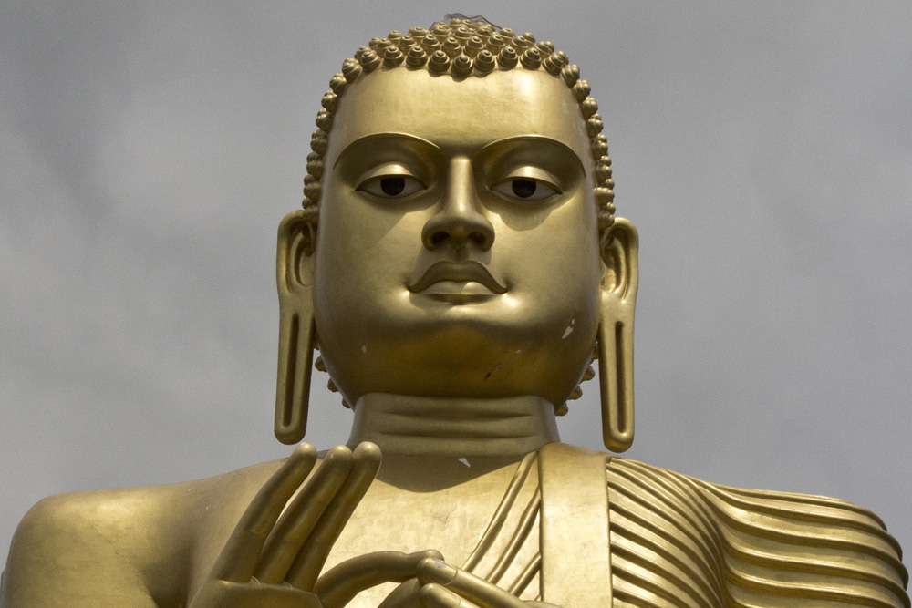 Golden Temple Buddha with rain clouds | Sri Lanka